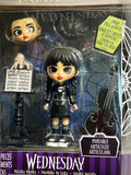 Wednesday Deluxe 6-inch Articulated Figure, 9 pieces, Interchangeable Face Plates and Fashion, Customizable Collectible Figurine, Kids Toys for Ages 3 Up